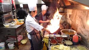 The Heat of the Indo-Chinese Wok Master's Kitchen on a Very Busy ...