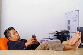 Lazy Office Worker Playing Mobile Game With Smartphone During ...