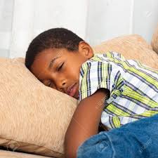 Close Up Of Cute Tired Child Boy Sleeping On Sofa. Stock Photo, Picture And  Royalty Free Image. Image 16960148.