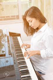 Beautiful Asian Woman Playing Piano Stock Photo, Picture And Royalty Free  Image. Image 68225263.